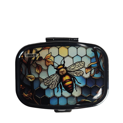 Bee decorative pill organizer featuring a colorful butterfly design with built-in mirror and two compartments.