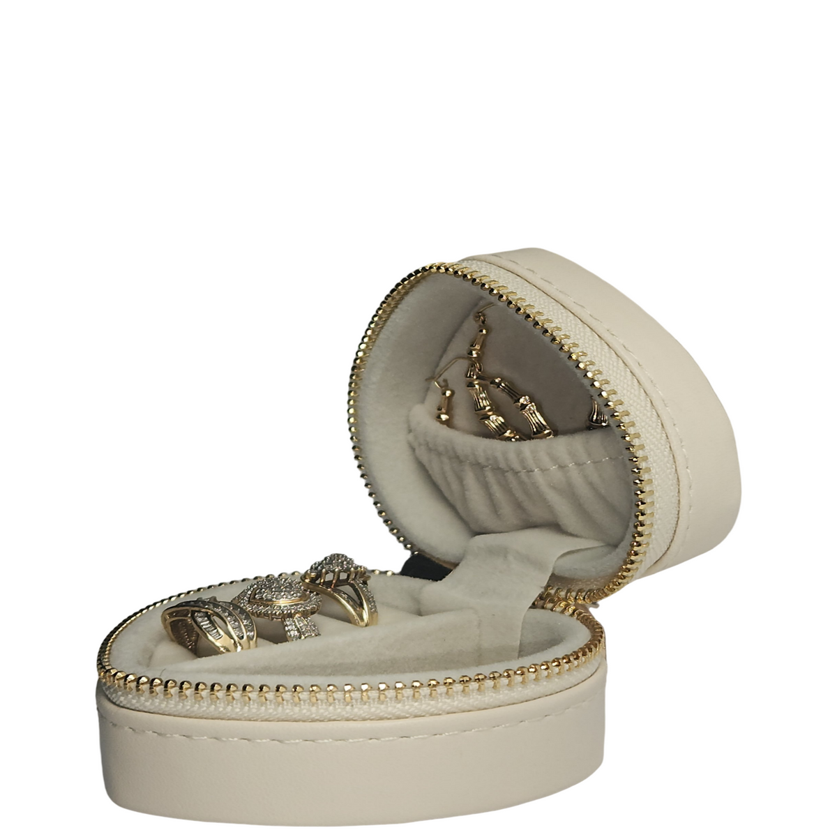Open cream heart-shaped jewelry organizer shown from the side, displaying rings and earrings in its soft- lined interior.