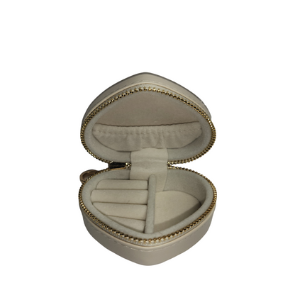 Open cream heart-shaped jewelry organizer showing empty ring holders, center divider, and interior pocket.