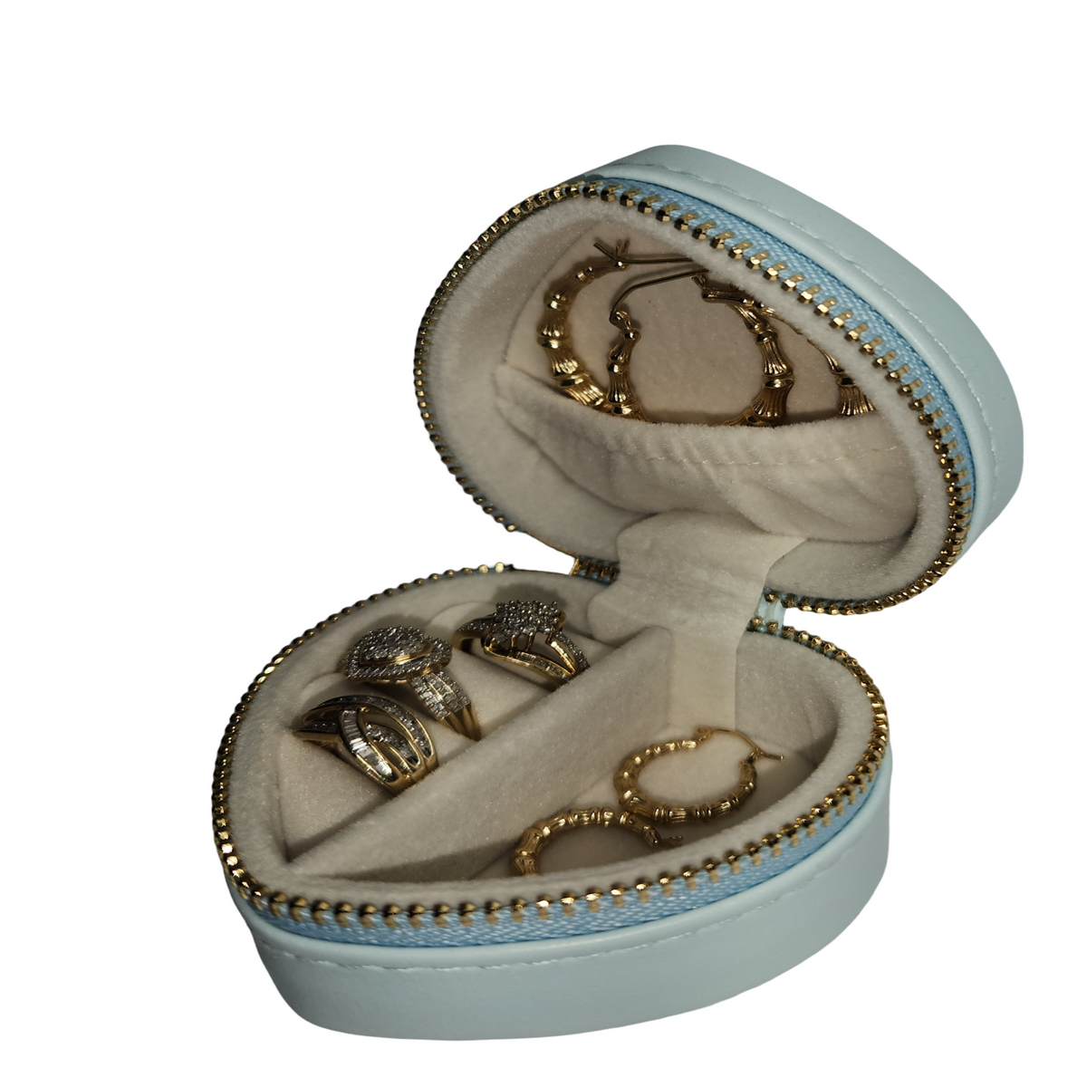 Open light blue heart-shaped jewelry organizer displaying rings and earrings in soft-lined interior.