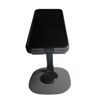 Gray adjustable folding aluminum phone stand holding a smartphone in an upright position.