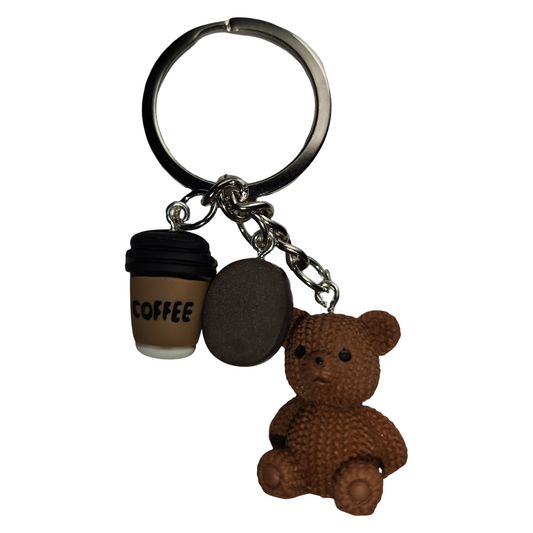 Brown teddy bear coffee keychain featuring a miniature coffee cu, coffee bean charm, and silver-tone key ring on a white background.