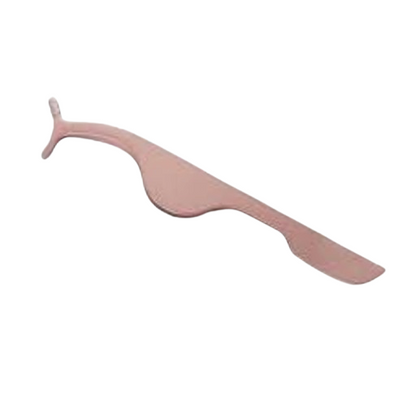 Pink tongue scraper on a white background
