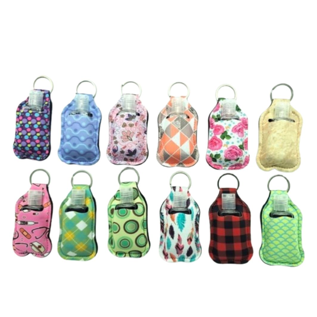 Assorted hand sanitizer keychain holders in various colors and patterns
