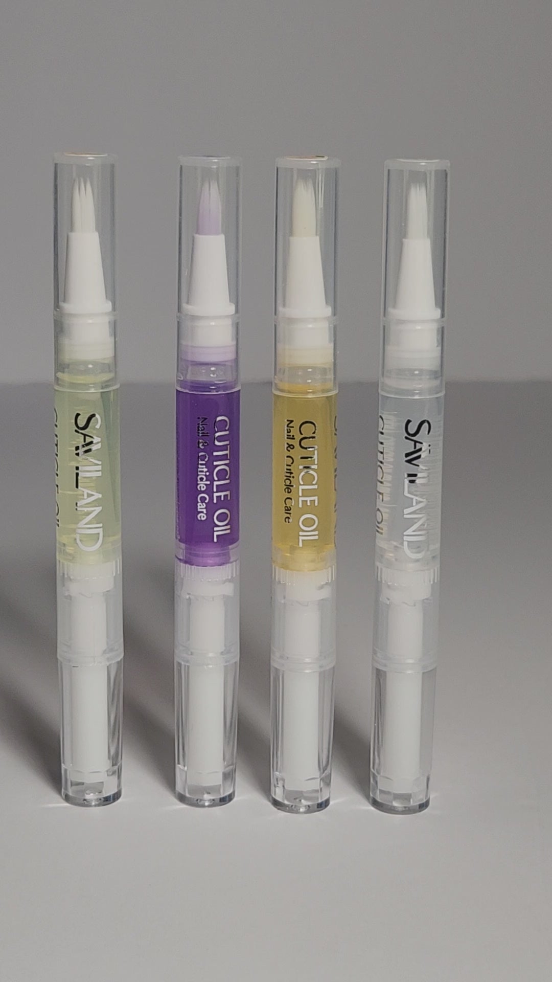 Set of four cuticle oil pens displayed together.